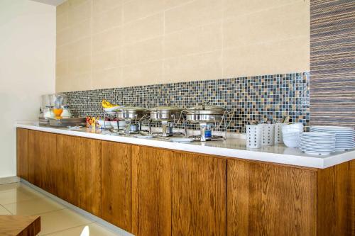 Kuchyň nebo kuchyňský kout v ubytování Sleep Inn Hermosillo