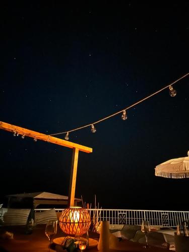 a table with a string of lights at night at Matteo Villa Limassol Cyprus in Limassol