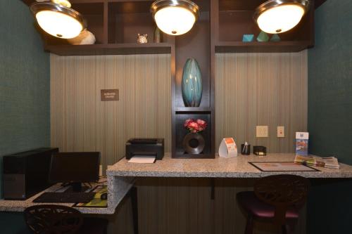 an office with a desk with a computer and chairs at Comfort Inn & Suites Newcastle - Oklahoma City in Newcastle