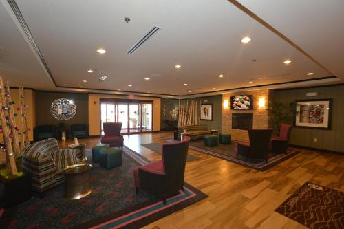 a lobby with couches and chairs in a building at Comfort Inn & Suites Newcastle - Oklahoma City in Newcastle