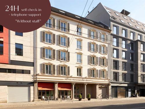 a large white building on a city street at Classik Hotel Hackescher Markt - Self Check In in Berlin