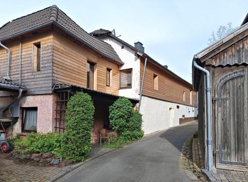 a house with a street in front of it at Haus am Burgring in Mürlenbach