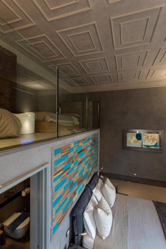 a bed in a room with a coffered ceiling at ArtStudio6 Dimora Artistica in Campobasso