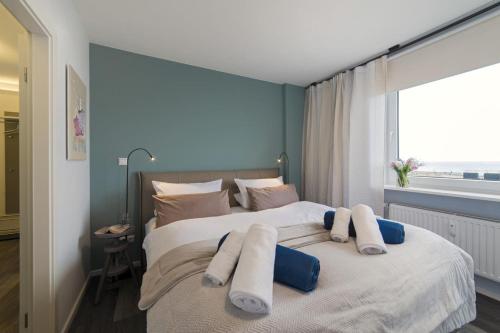 Postel nebo postele na pokoji v ubytování Ihr Sonnendeck in Staberdorf – mit 180° Meerblick