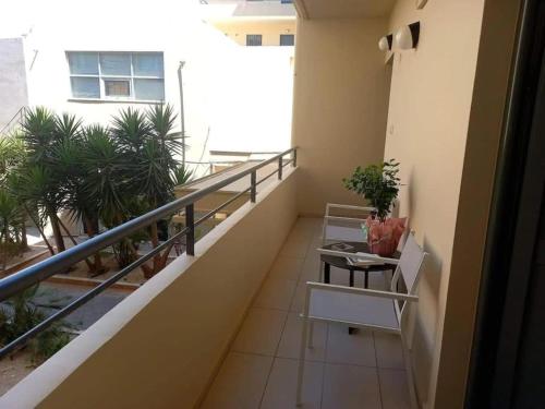 a balcony of a building with plants on it at Luxury apartment in the heart of the city in Chania Town