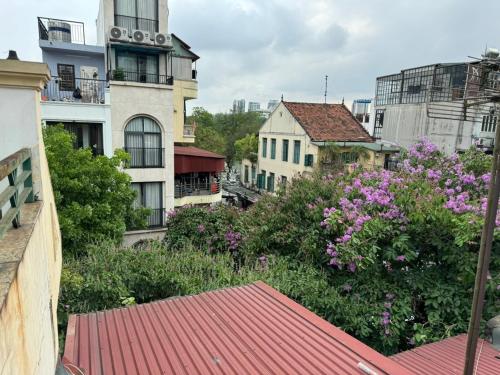 a view of a city with flowers and buildings at Quynh Moon homestay in Hanoi