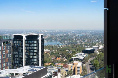a view of a city from a building at St Leonards 2B2B Apt with Skyview in Sydney