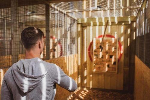 a young boy looking at a bird cage at 7, Rabbits Run, Camp Tapnell in Yarmouth