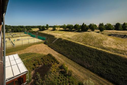 an aerial view of a field with a tennis court at Park Holiday Congress & Wellness Hotel in Prague
