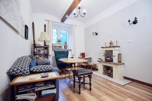 a living room with a couch and a table at 29 Avenue Apartments in Kraków