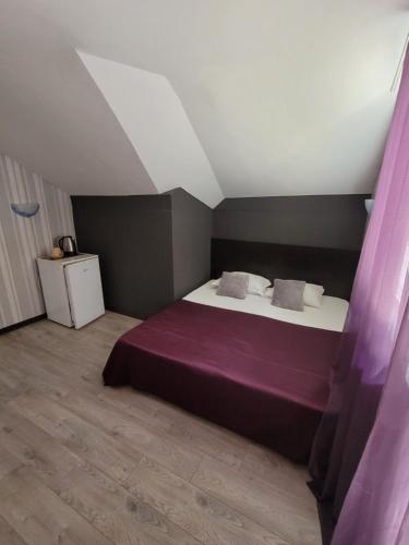 Ένα ή περισσότερα κρεβάτια σε δωμάτιο στο Guest House Taligarov