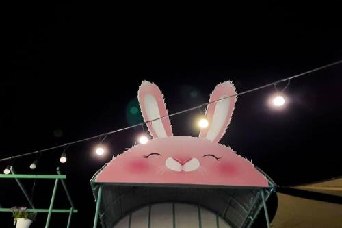 a bunny head on top of a building at night at See Sky Resort in Ban Sao Thong