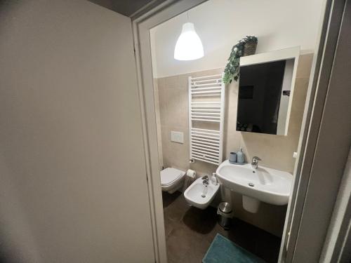 a bathroom with a sink and a toilet at Casa Digio in Pescara