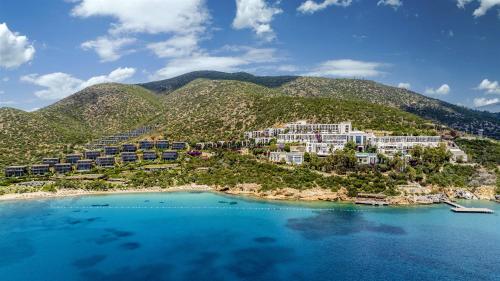 an aerial view of a resort on a mountain at Kempinski Hotel Barbaros Bay Bodrum in Yaliciftlik