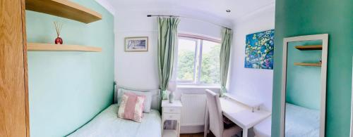 a small room with two beds and a window at Modern and chic rooms with beautiful landscape views in Sydenham