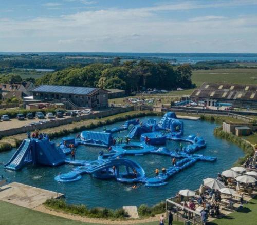 a water park with a bunch of water slides at 10 Roosters Ridge, Camp Tapnell in Yarmouth