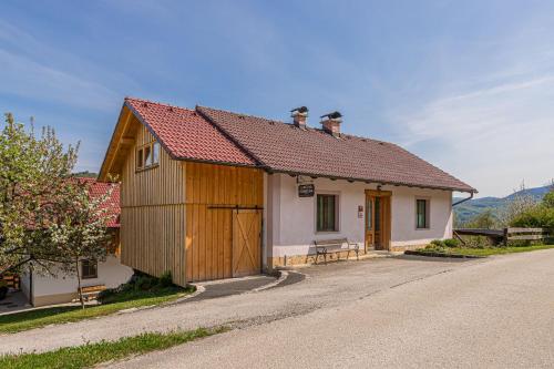 a small house on the side of a road at Fun and Games Homestead Lukec - Happy Rentals in Kostel