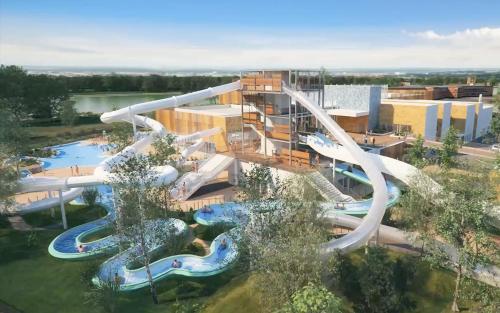 - une vue aérienne sur un parc aquatique avec toboggan dans l'établissement Meublé de tourisme classé 3 étoiles Le Ptit Coin de Soleil - Saint Ciers d'Abzac, à Saint-Ciers-dʼAbzac