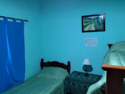 Cama o camas de una habitación en Hostería el Sol Naciente