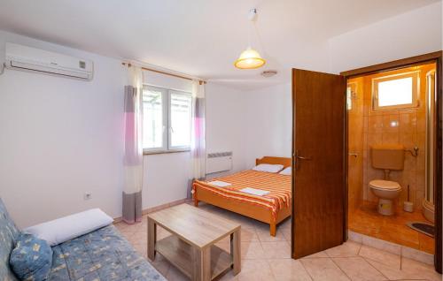 a small room with a bed and a bathroom at 4 Bedroom Lovely Apartment In Krusevo in Kruševo