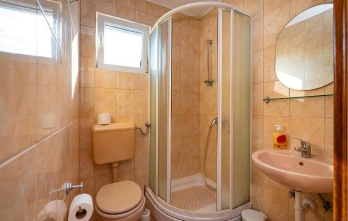 a bathroom with a shower and a toilet and a sink at 4 Bedroom Lovely Apartment In Krusevo in Kruševo