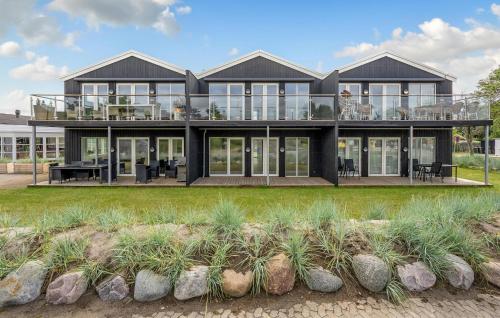 a large house with glass doors and windows at Nice Apartment In Slagelse With Kitchen in Slagelse