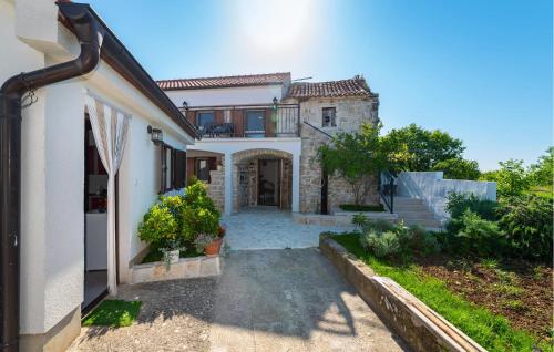 a house with a staircase leading to the front yard at Lovely Home In Slivnica With Wifi in Slivnica