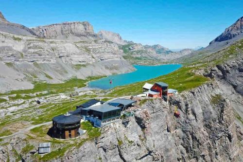 an aerial view of a house on the edge of a mountain at DOMINO - Superbe studio de standing in Leukerbad