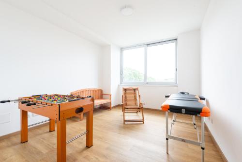 a room with a table and a chess board on a table at Ottavia Residence Roma in Rome
