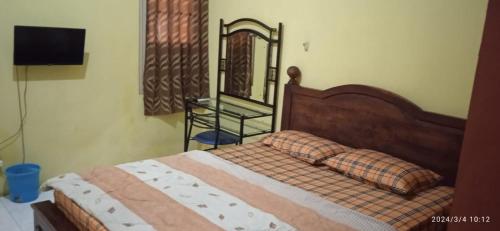 Postel nebo postele na pokoji v ubytování Istana Griya 1