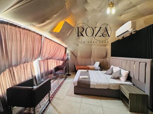 a hotel room with a bed and a chair at Rum Roza luxury camp in Wadi Rum