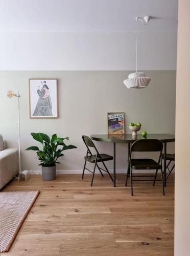 a dining room with a table and chairs at Apartment Zwirn, free parking, 24/7 access in Nivy
