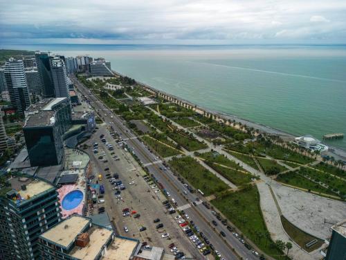 an aerial view of a city and the ocean at New Wave Apart-Hotel in Batumi
