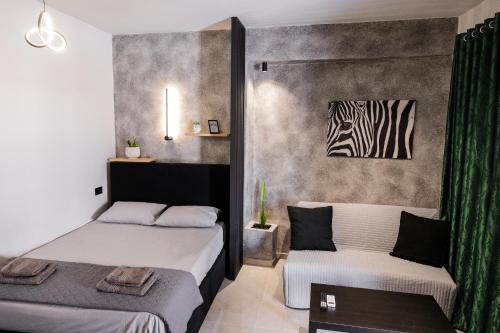 Postel nebo postele na pokoji v ubytování Frourio Lodge A3