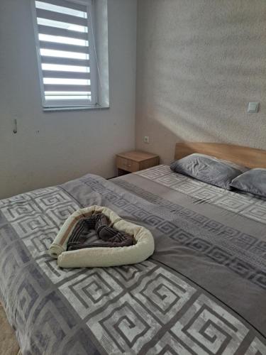 a bedroom with two beds and a blanket on the bed at Villa&Restaurant Strmec in Elshani