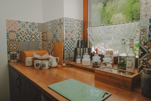 a counter with various items on it in a kitchen at Noclegi nad Zalewem Bukówka in Lubawka
