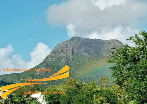 a mountain with a rainbow in front of it at La Nuit Étoilée in La Gaulette