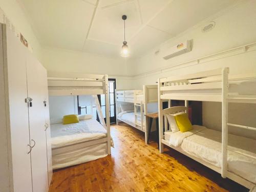 a room with three bunk beds in it at D114 Victorian Central Stay in Melbourne