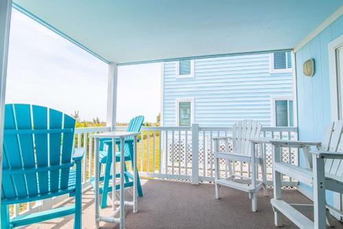 two chairs and a table on a balcony at Oceanfront and Modern Top Location on Ocean Blvd w Pool in Myrtle Beach
