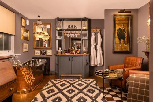 a living room with a bar and a couch at The Barth Room at Cheshire Boutique Barns in Nantwich