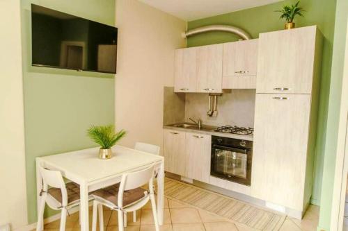 Virtuvė arba virtuvėlė apgyvendinimo įstaigoje Appartamento Corte della Spiga