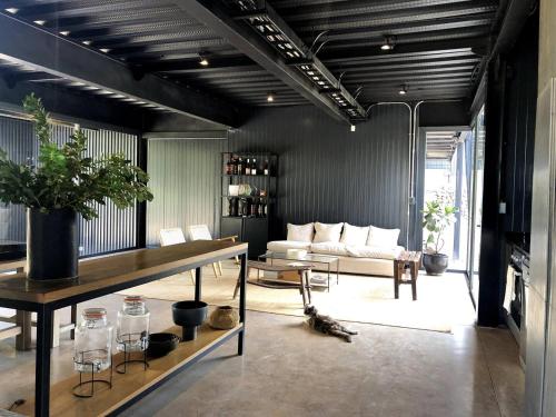 a living room with a couch and a table at Viña LOF - Maipo Valley Bed & Breakfast in Winery in Paine