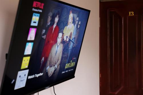 TV a/nebo společenská místnost v ubytování Casanova Inn - Boutique Hotel