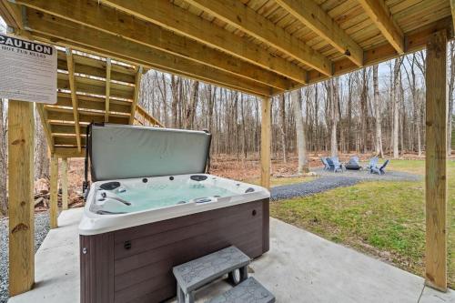 a pool table under a pergola with a pool table at Big Villa,4 Masters, Heated Pool, Hot Tub, Sauna in Blakeslee
