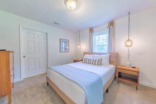 a bedroom with a large bed and a window at Lake Murray Family Retreat in Hollywood Point