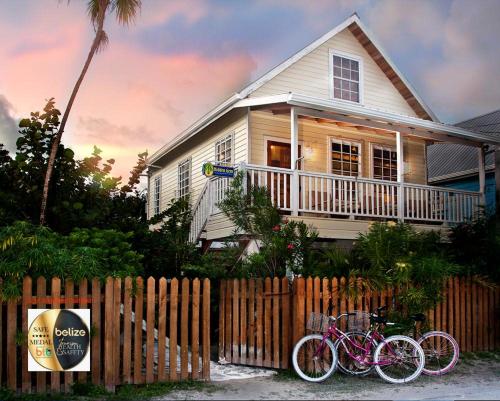 two bikes parked in front of a house at Hidden Gem Cabana in Caye Caulker