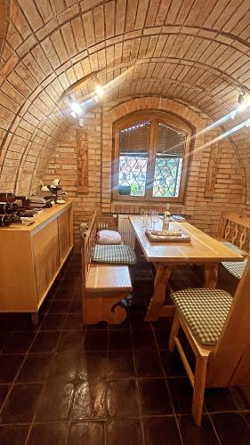 a kitchen with a table and chairs in a room at Sklep u Dušana in Vracov