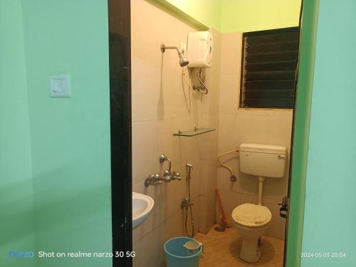 a bathroom with a toilet and a sink at 4 Bhk Independent Villa At Pushpanjali Residency Phase 2 Bunglow No A1 Owale Ghodberder Road Thane West in Thane