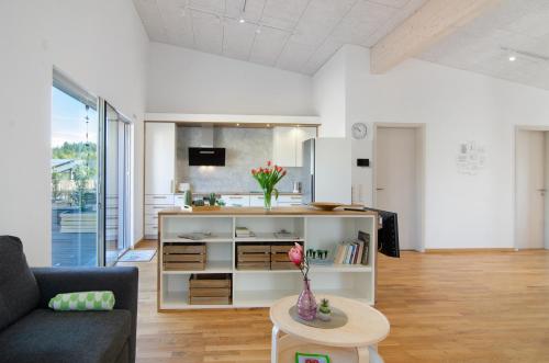 a living room with a couch and a table at Ferienwohnungen Walz in Pfullendorf