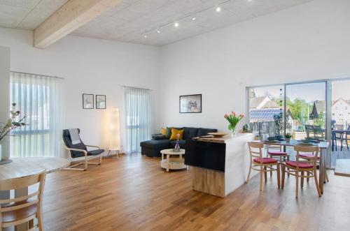 a living room with a couch and a table at Ferienwohnungen Walz in Pfullendorf